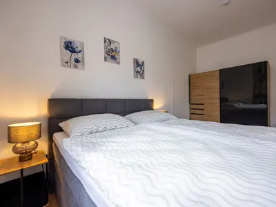 Steinmetz-Haus "Appartement Stadtblick" - Schlafzimmer mit Doppelbett