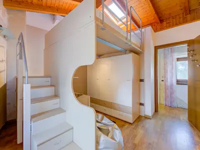 Das Hauptschlafzimmer mit Mezzanine-Bett