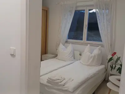 Schlafzimmer 2 mit zwei getrennten Betten