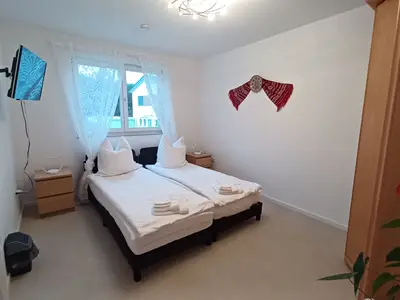Schlafzimmer 3 mit zwei getrennten Betten