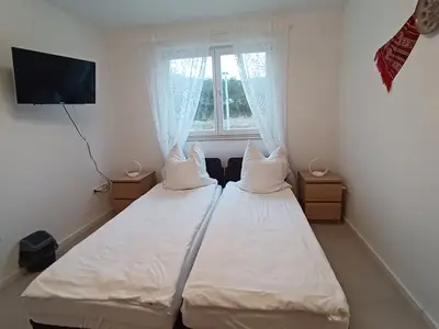 Schlafzimmer 3 mit zwei getrennten Betten