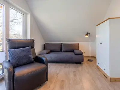 Ferienhaus SchönSicht Blick in eines der Schlafzimmer mit Schlafcouch