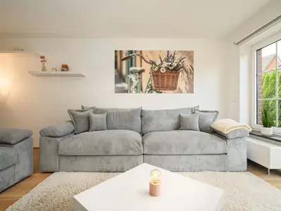 Ferienhaus Landhus Alt Schwerin Wohnzimmer mit großem Sofa