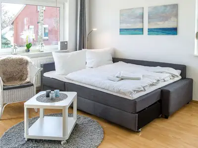 Wohnzimmer mit Schlafsofa