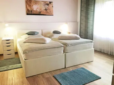 Haus-Wallberg-Schlafzimmer-2-Ansicht1-400x284