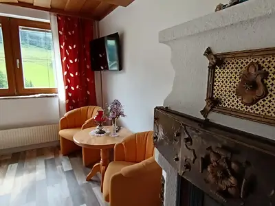 Haus Bernkogel Dorfgastein Wohnraum Kamin