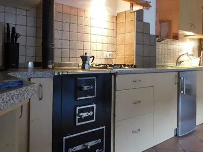 Küche mit Trentiner Holzofen