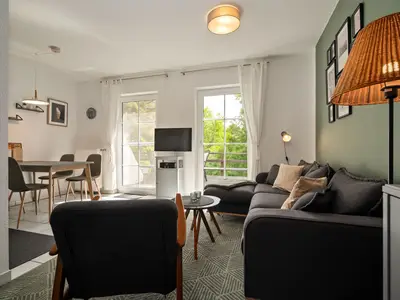 Ferienhaus Waldblick am Plauer See Wohnzimmer mit TV -Einheit