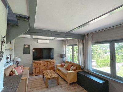 Wohnzimmer, TV-Longe, Sitzbereich, Kamin