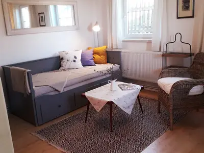 Wohnzimmer mit ausziehbarem Tagesbett