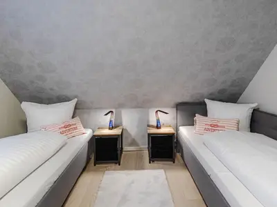Ferienhaus Wasserblick Schlafzimmer mit zwei Einzelbetten