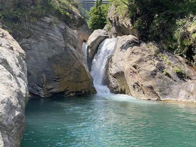 Waterfall with natural pool to swim about 2 - 5min behind the house