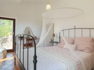 Schlafzimmer "Rose" mit Zugang zur Terrasse