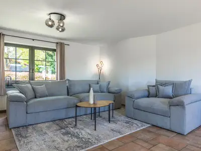 Ferienhaus Wiesenquartier Penkow Wohnzimmer mit großer Couch