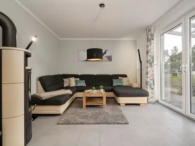 Ferienhaus Aurora Roebel Wohnzimmer mit Kamin
