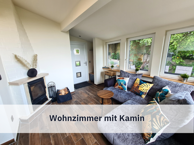 Wohnzimmer mit tollem Ausblick, Kamin und Klimaanlage