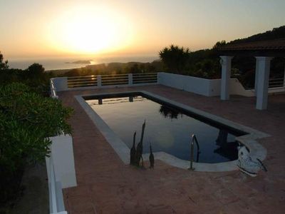 Swimming pool with sunset