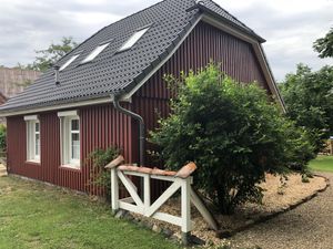 Lütt hus mit Garageneinfahrt