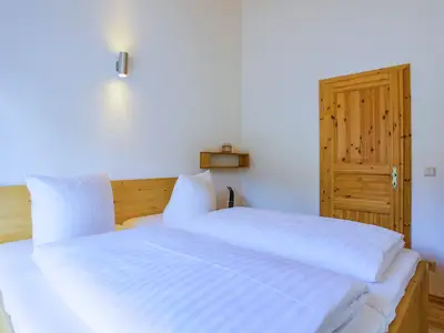 Ferienhaus MöwenKieker Blick in das Schlafzimmer