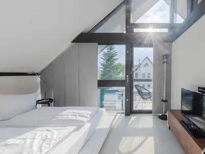 Ferienhaus HUF-Haus in Waren (Waren Müritz) Blick in das Schlafzimmer im Obergeschoss