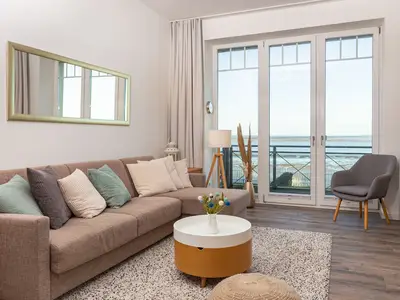 Wohnzimmer mit Meerblick in der Ferienwohnung Amrumer Strandhaven in Wittdün