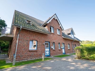 Die Wohnung Nr. 5 befindet sich von der Straße aus gesehen ganz rechts.