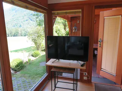 Wintergarten mit Ausgang zur überdachten Terrasse