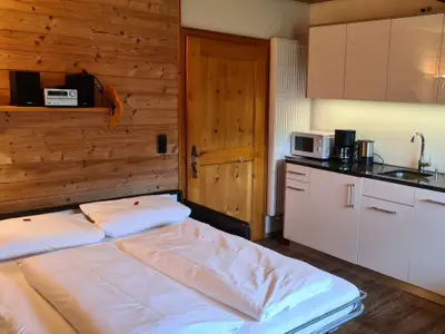 Wohnküche mit ausgezogenem Schlafsofa Bauernhaus 5