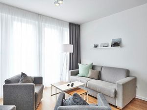 Wohnbereich mit Couch und Sesseln