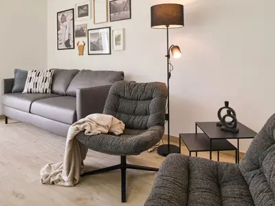 Wohnbereich mit Sofa Fewo Sunshower