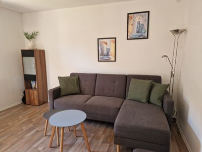 Wohnzimmer mit Schlafsofa