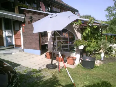 überdachte Pergola Südseite mit Grill