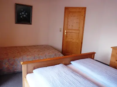 Schlafzimmer mit Zustellbett