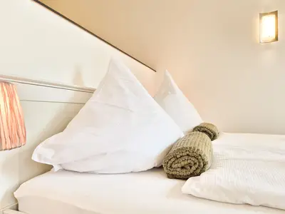 Schlafbereich mit Doppelbett Fewo Alpennest