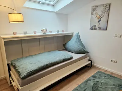 Schrankbett im Wohnzimmer Ferienwohnung Kehlsteinblick