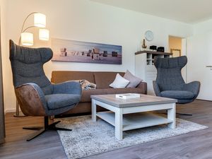 Wohn-/Essbereich mit Sitzgelegenheiten und Doppelschlafcouch