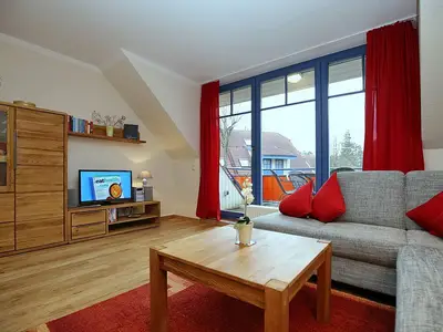 Wohnzimmer mit Ecksofa und TV
