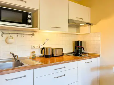 Küchenzeile im Wohnzimmer integriert