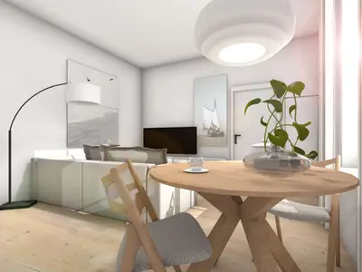 Blick auf Eingangstür mit Sofa und TV