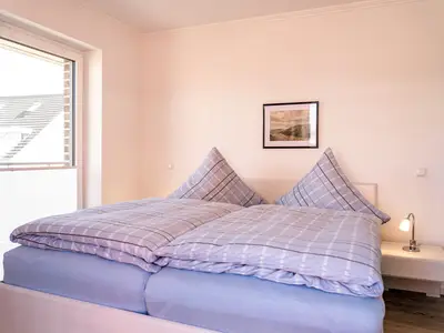 Schlafzimmer mit Balkon