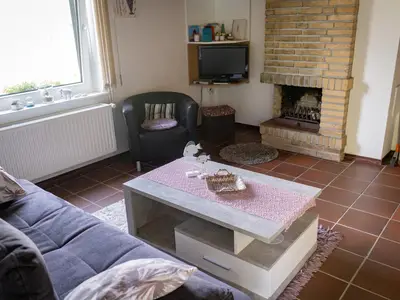 Wohnzimmer mit Kamin Fewo West