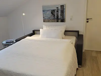 Sofa als Bett ausgezogen