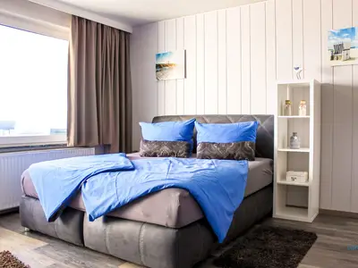 Cuxland-Fewo-Service - Haus Atlantic  - Wohnung 607 A  - Wohn - Schlafzimmer