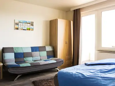 Cuxland-Fewo-Service - Haus Atlantic  - Wohnung 607 A  - Wohn - Schlafzimmer
