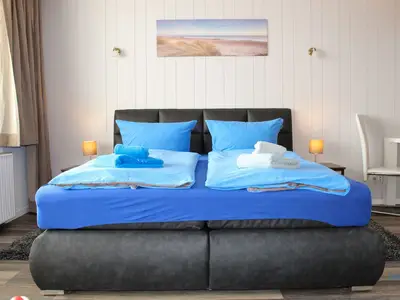 Cuxland-Fewo-Service - Haus Atlantic  - Wohnung 607 B  - Wohn - Schlafzimmer