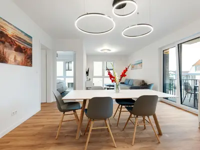 Ankommen, durchatmen, entspannen – moderne Ferienwohnung mit Sauna, nur einen Steinwurf vom Ostseestrand entfernt.