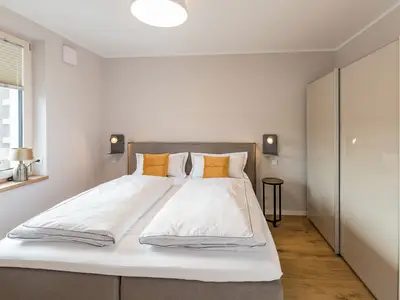 Suites MITTE Schlafzimmer/Boxspringbett