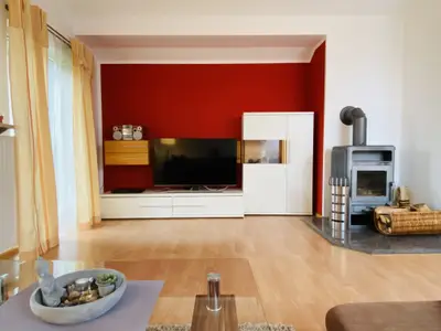 Ferienwohnung Bellissima - Wohnzimmer mit Kamin
