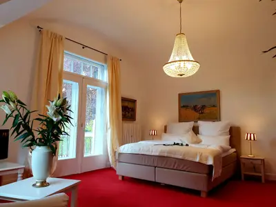 zweites Schlafzimmer mit Sitzecke und TV
