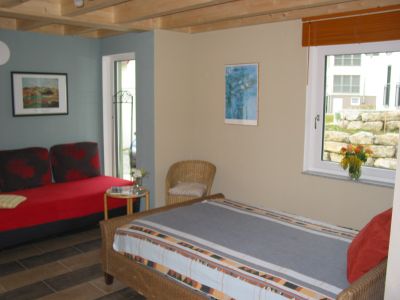 Schlafzimmer mit Sitzecke